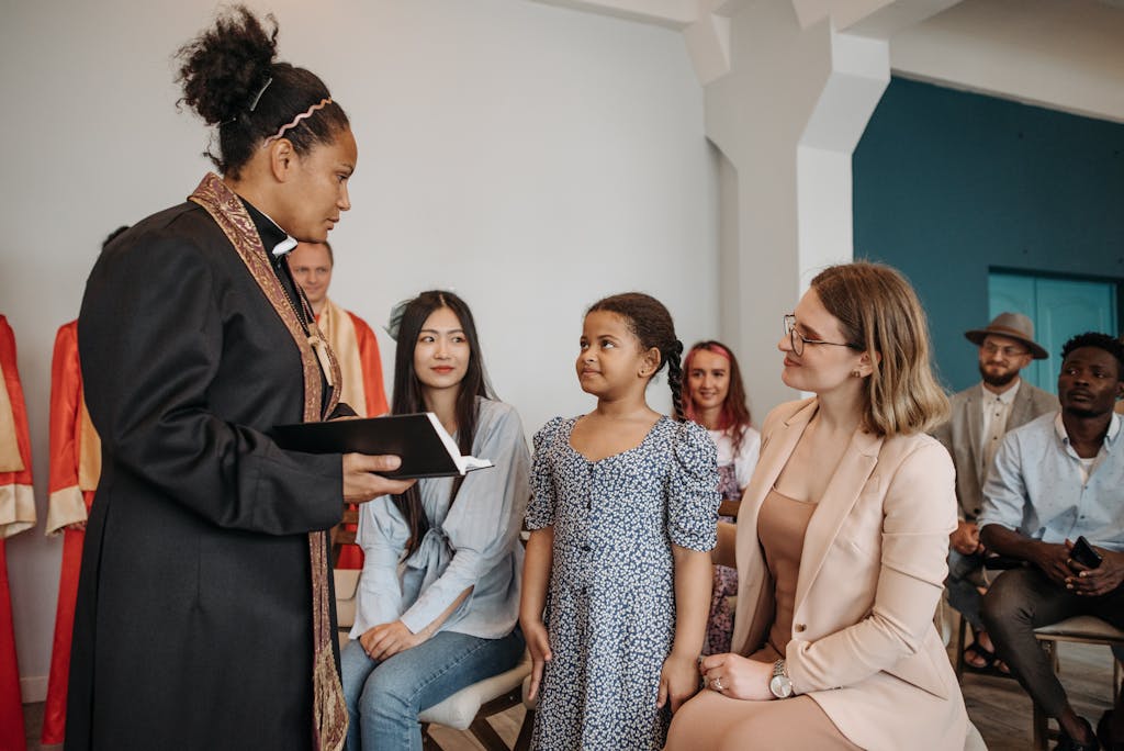 A diverse group of people attending a church service led by a pastor indoors.